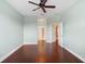 Hardwood floor bedroom with access to bathroom and hallway at 22011 Belgian Ct, Mount Dora, FL 32757