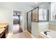 Spa-like bathroom with walk-in shower and soaking tub at 22011 Belgian Ct, Mount Dora, FL 32757