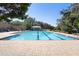 Community pool with plenty of lounge chairs and shaded areas at 22011 Belgian Ct, Mount Dora, FL 32757