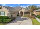 Beautiful home exterior with landscaping and driveway at 22011 Belgian Ct, Mount Dora, FL 32757