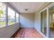 Covered screened porch with tile floor, access to backyard at 3121 Bon Air Dr, Orlando, FL 32818