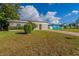 House exterior showcasing landscaping and a long driveway at 3121 Bon Air Dr, Orlando, FL 32818