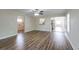 Hardwood floor living room with kitchen and bathroom access at 3121 Bon Air Dr, Orlando, FL 32818