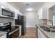 Modern kitchen with stainless steel appliances and granite countertops at 3121 Bon Air Dr, Orlando, FL 32818