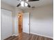 Bright bedroom with double door closet and wood-look flooring at 3121 Bon Air Dr, Orlando, FL 32818