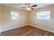Spacious bedroom with hardwood floors and ceiling fan at 3121 Bon Air Dr, Orlando, FL 32818