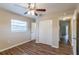 Well-lit bedroom with double closets and ceiling fan at 3121 Bon Air Dr, Orlando, FL 32818