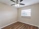 Well-lit bedroom with hardwood floors and window at 3121 Bon Air Dr, Orlando, FL 32818