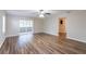 Living room with hardwood floors and sliding doors to patio at 3121 Bon Air Dr, Orlando, FL 32818