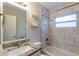 Updated bathroom with granite vanity and marble-look tile at 3121 Bon Air Dr, Orlando, FL 32818