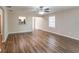 Open living room with hardwood floors and kitchen view at 3121 Bon Air Dr, Orlando, FL 32818