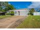 House exterior with a red door and a long driveway at 3121 Bon Air Dr, Orlando, FL 32818