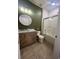 Bathroom with a bathtub, shower, and wood vanity at 4562 Baleno Ln, Kissimmee, FL 34746