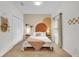 Bedroom with a queen bed and neutral color scheme at 4562 Baleno Ln, Kissimmee, FL 34746