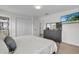 Primary bedroom with king-size bed, dresser, and large closet at 4562 Baleno Ln, Kissimmee, FL 34746