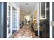 Bright and spacious entryway with a stylish console table and faux fur rug at 4952 Creekside Park Ave, Orlando, FL 32811