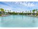 Relaxing resort-style pool with a fountain and palm trees at 2777 Nature View Rd, Saint Cloud, FL 34771