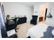Bedroom with a desk, chair, and en-suite bathroom access at 1532 Nassau Point Trl, Kissimmee, FL 34747