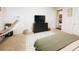 Cozy bedroom with a comfortable bed, dresser, and hammock at 1532 Nassau Point Trl, Kissimmee, FL 34747
