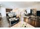 Open concept living area with kitchen, dining, and living spaces at 1532 Nassau Point Trl, Kissimmee, FL 34747