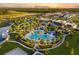 Community with resort-style pool, clubhouse, and lush green spaces at 1532 Nassau Point Trl, Kissimmee, FL 34747