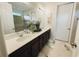 Double vanity bathroom with modern fixtures and decor at 1532 Nassau Point Trl, Kissimmee, FL 34747