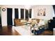 Bright living room featuring a large sectional sofa and stylish decor at 1532 Nassau Point Trl, Kissimmee, FL 34747