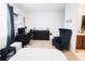 Bedroom with a desk, chair, and nautical-themed decor at 1532 Nassau Point Trl, Kissimmee, FL 34747