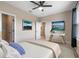 Bright bedroom with a bed, TV, and private closet at 1352 Silo Dr, St Cloud, FL 34771