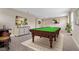 Game room with a pool table and seating at 1352 Silo Dr, St Cloud, FL 34771