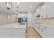 Spacious kitchen with white cabinets, stainless steel appliances, and a large island at 1352 Silo Dr, St Cloud, FL 34771