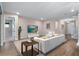Open living room with neutral tones, comfortable seating, and access to backyard at 1352 Silo Dr, St Cloud, FL 34771