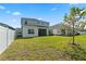 Large backyard with grassy lawn and privacy fence at 1352 Silo Dr, St Cloud, FL 34771