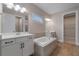Bathroom with double vanity and garden tub at 1352 Silo Dr, St Cloud, FL 34771