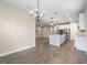 Bright dining area with chandelier and access to kitchen at 1352 Silo Dr, St Cloud, FL 34771