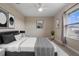 Cozy bedroom with a queen-size bed and window at 1352 Silo Dr, St Cloud, FL 34771