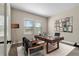 Bright home office with large desk and wall art at 1352 Silo Dr, St Cloud, FL 34771