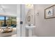 Modern powder room with pedestal sink and contemporary decor at 4715 Terra Esmeralda Dr, Kissimmee, FL 34746