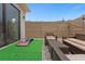 Fenced patio with artificial turf and seating area at 4715 Terra Esmeralda Dr, Kissimmee, FL 34746