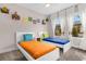 Bedroom with two twin beds and colorful accents at 4715 Terra Esmeralda Dr, Kissimmee, FL 34746