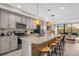 Modern kitchen with stainless steel appliances and a large island at 4715 Terra Esmeralda Dr, Kissimmee, FL 34746