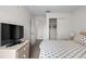 Bedroom with king bed, dresser, and closet at 1029 Park Ridge Cir, Kissimmee, FL 34746