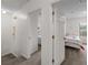 Upstairs hallway with doors to bedrooms and stairs at 1029 Park Ridge Cir, Kissimmee, FL 34746