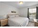 King bedroom with a dresser and large window at 1029 Park Ridge Cir, Kissimmee, FL 34746