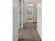 Hallway with carpet and doors leading to bedrooms and bathroom at 1029 Park Ridge Cir, Kissimmee, FL 34746