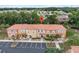 Aerial view of townhouses with parking and landscaping at 1029 Park Ridge Cir, Kissimmee, FL 34746