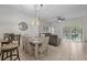 Bright dining area with table and chairs, located near the kitchen at 1029 Park Ridge Cir, Kissimmee, FL 34746