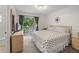 Main bedroom with king-size bed and private balcony access at 1029 Park Ridge Cir, Kissimmee, FL 34746