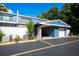 Exterior of light blue townhome with carport and reserved parking at 172 Lago Vista Blvd, Casselberry, FL 32707