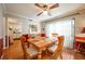 Bright dining area with wood table and chairs, kitchen view at 172 Lago Vista Blvd, Casselberry, FL 32707